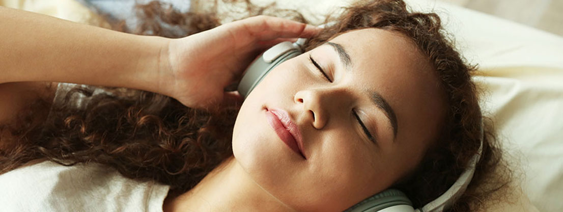 Woman listens meditation