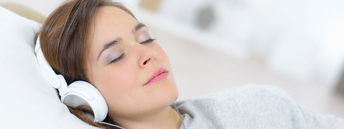 Woman sleeps with music