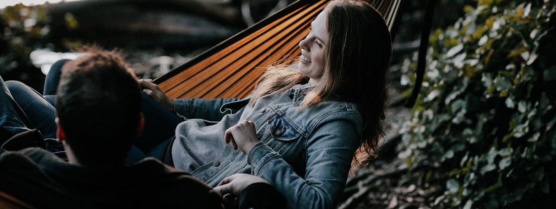 Man and woman in hammock, social community