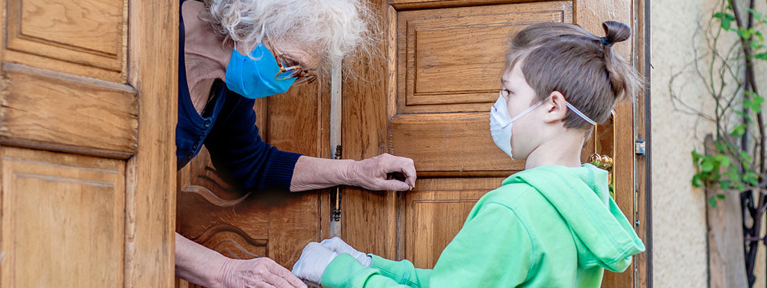 Boy helps old woman, solidarity