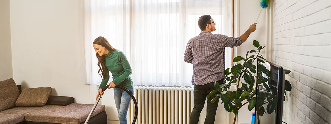 Man and woman cleaning room, get rid of old things