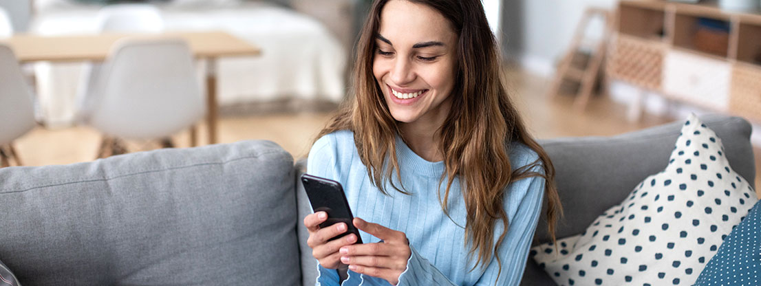 young woman keeps contact via cell phone