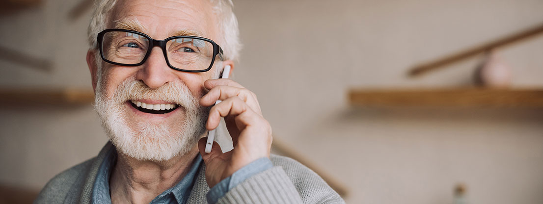 Grandpa with cell phone, joy of social attention