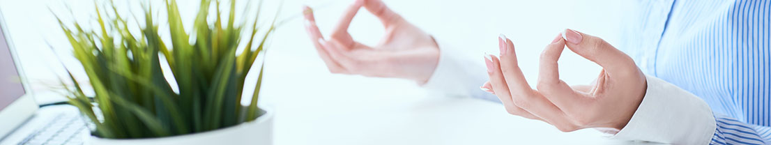 Woman meditates and relaxes at work