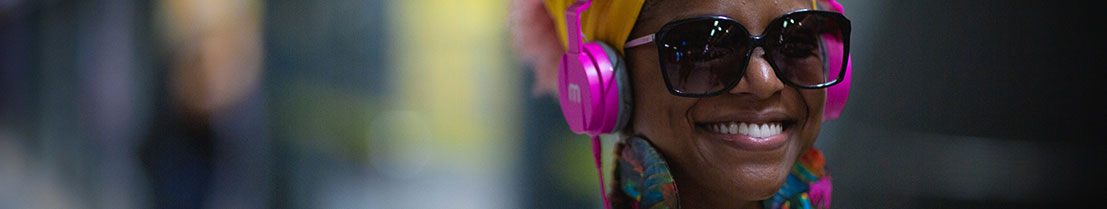 Woman listening to binaural beats with headphones.